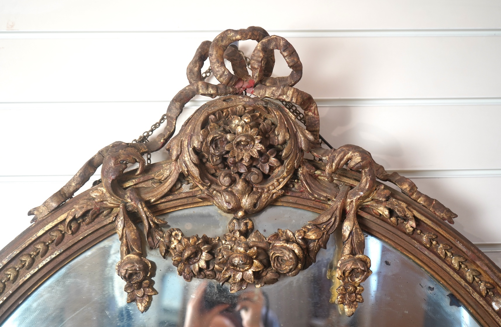 A large Louis XVI style gilt and composition girandole wall mirror